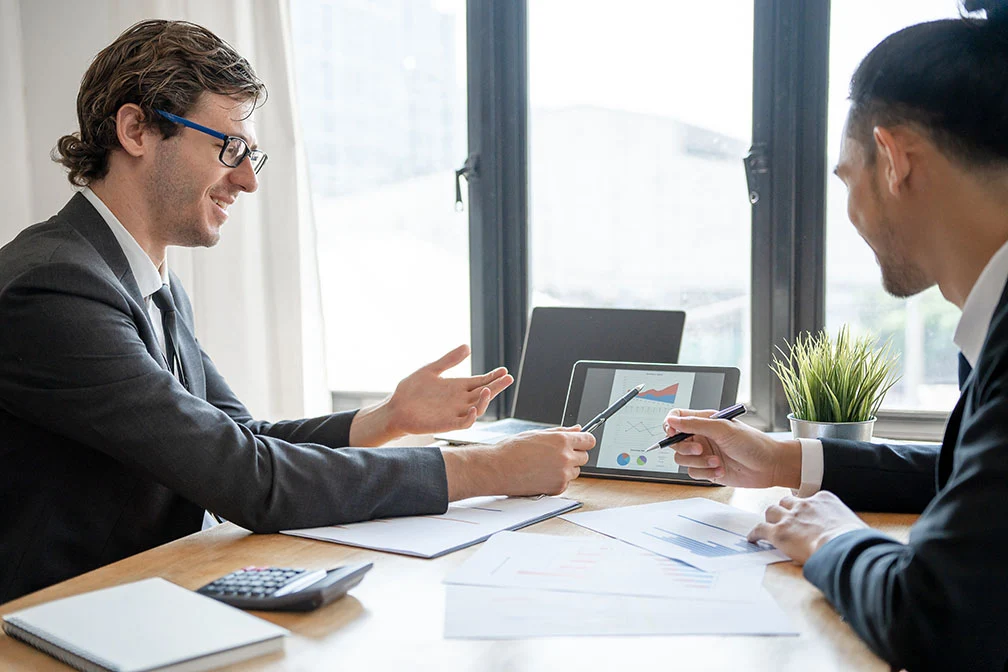 Business owner reviewing treasury management tools on a laptop